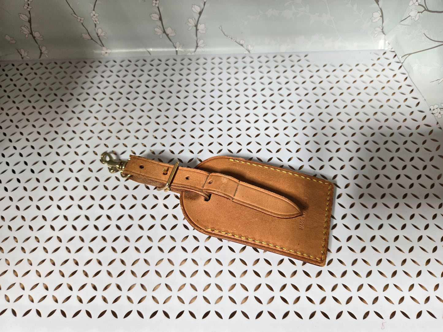 Authentic luggage tag with upcycled bow bag charm.