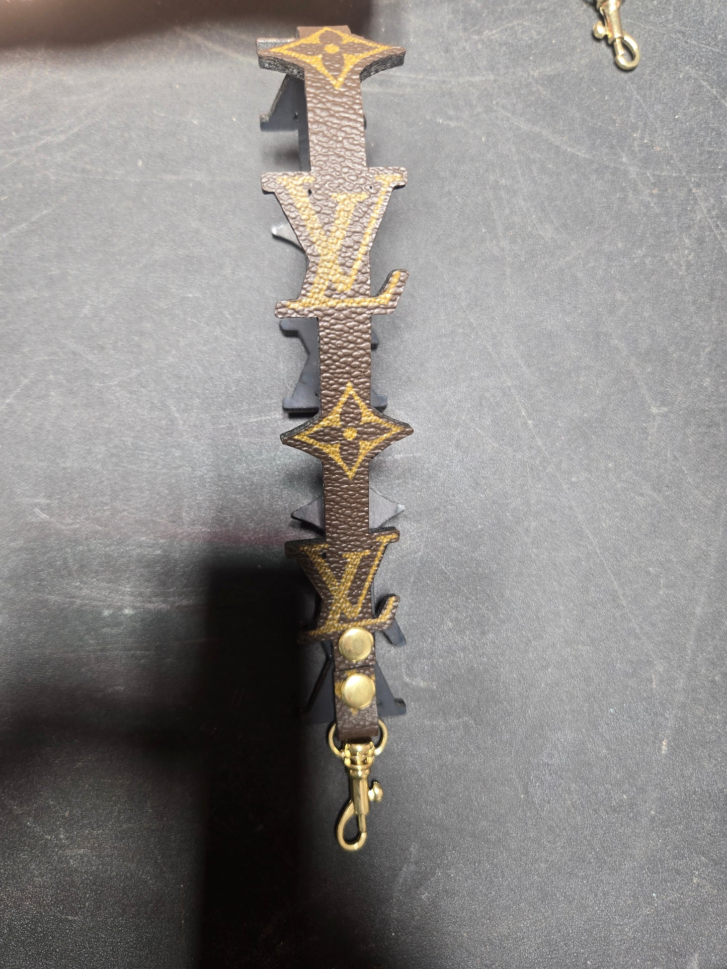 Upcycled wristlet cutout shaped