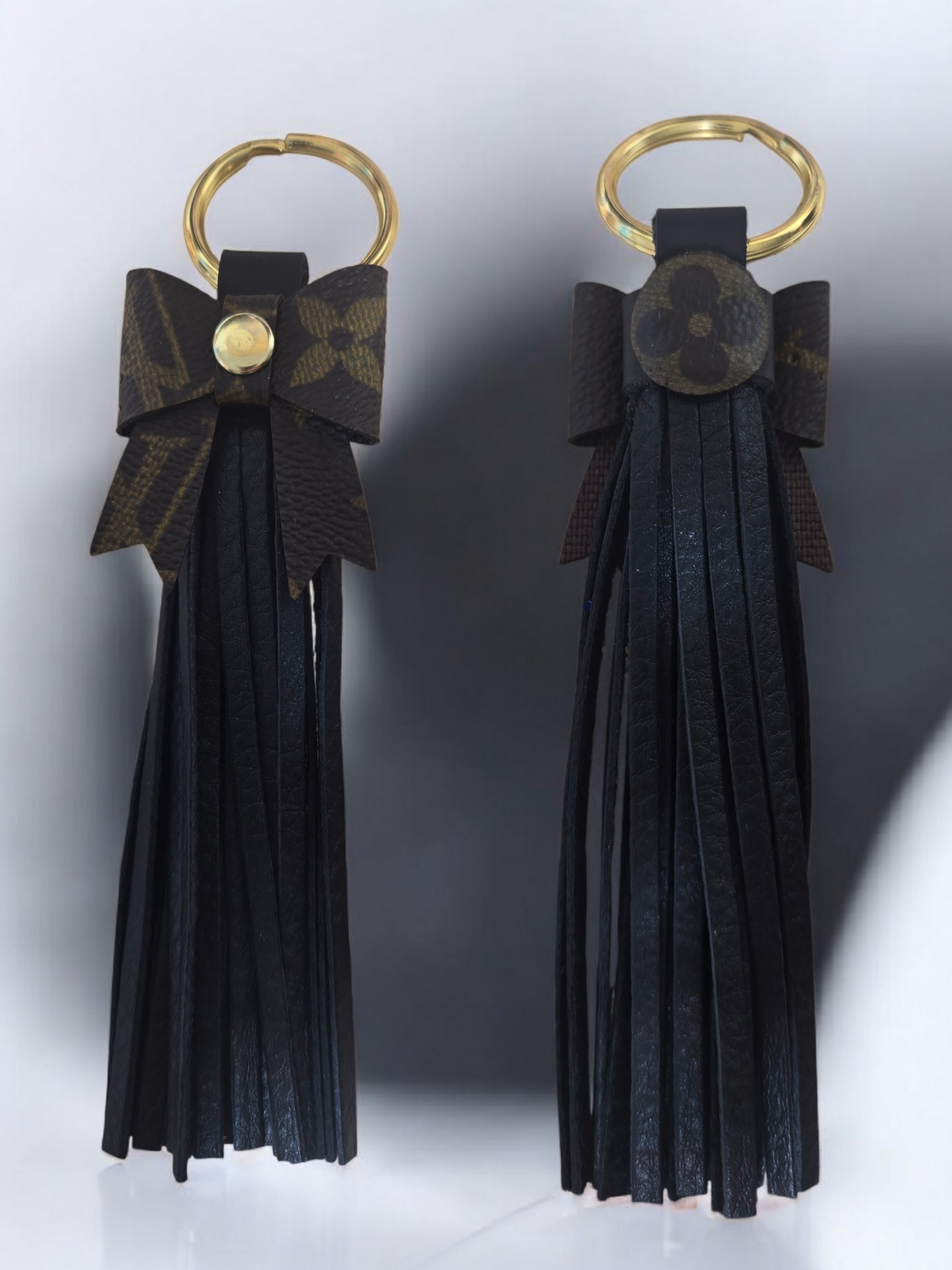 Upcycled leather tassle bow.