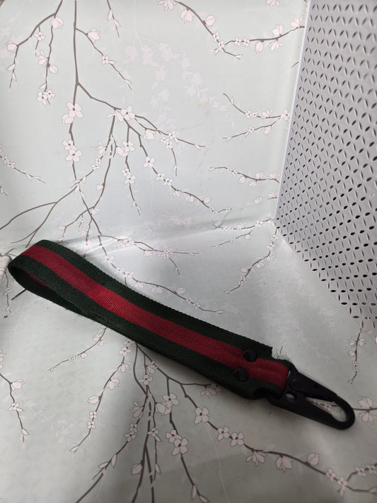 Upcycled green and red stripe wristlet