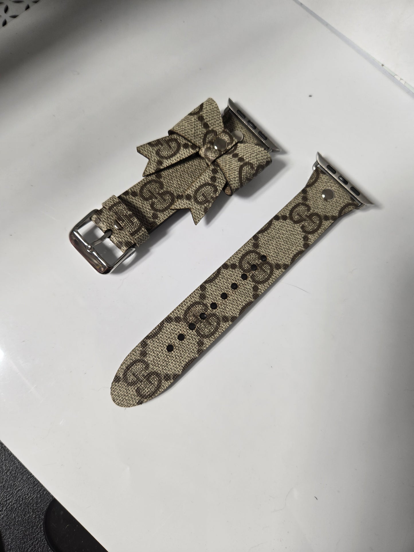 Upcycled watchband with upcycled bow.