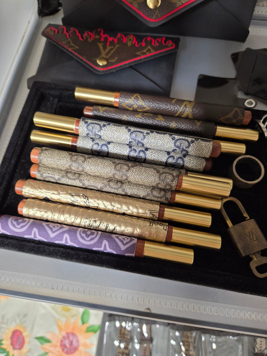 13 upcycled wristlets and 11 upcycled pens bundle