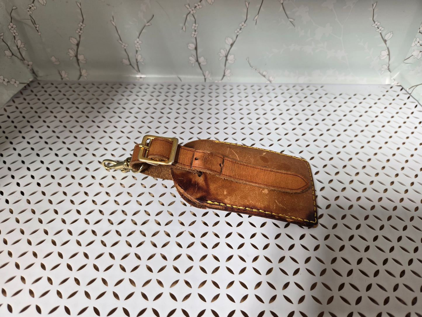 Authentic luggage tag with upcycled bow bag charm. HAS STAINS AS IS.