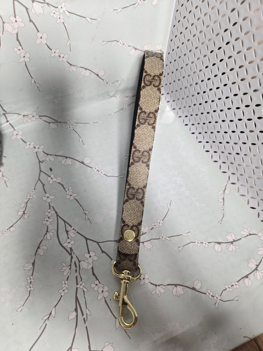 Upcycled wristlet gold clasp