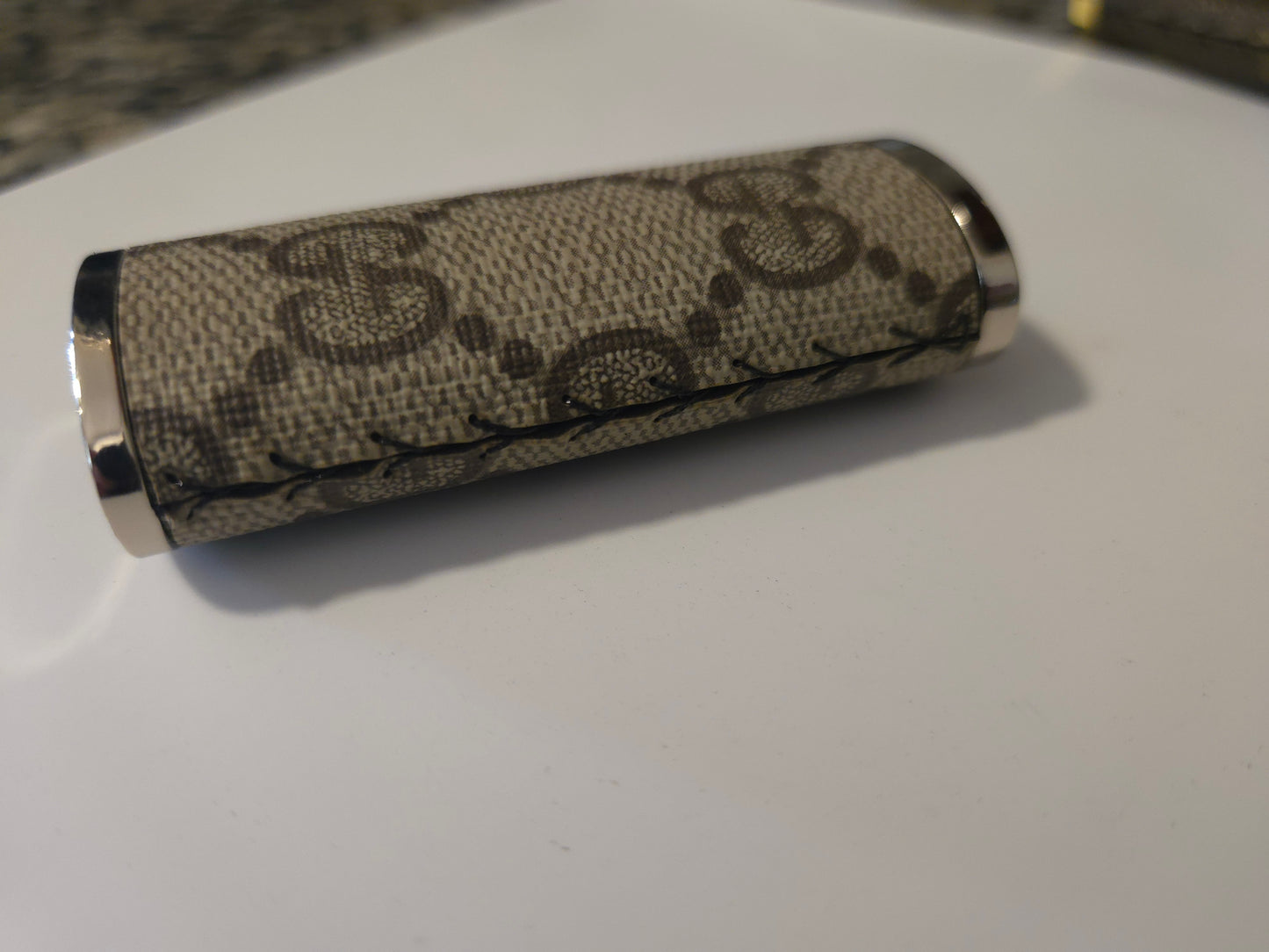 Upcycled hand sewn lighter case.