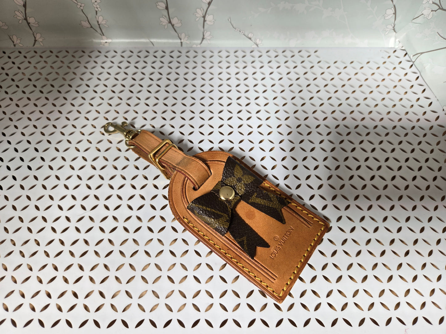 Authentic luggage tag with upcycled bow bag charm.