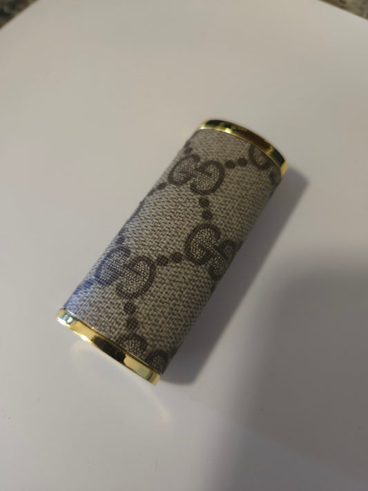 Upcycled lighter case fits normal Bic lighter.  Hand sewn.